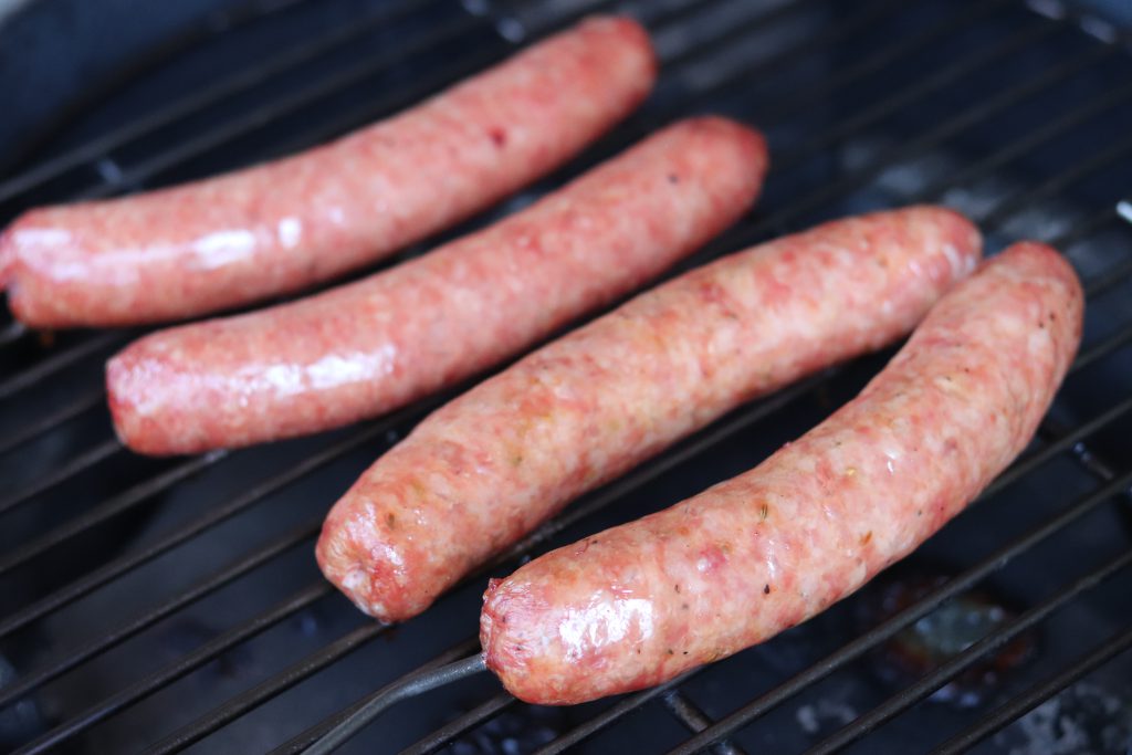 Sausages on the Big Green Egg, parallel to grate.